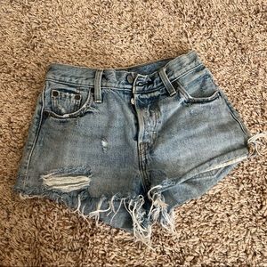 Levi distressed light wash shorts. Size 23